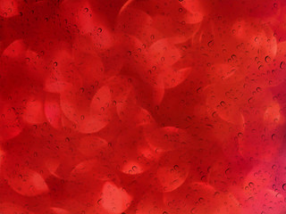 Wall Mural - Romantic red bokeh and water drop on glass mirror plate abstract