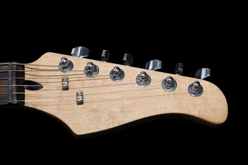 electric guitar headstock isolated on black