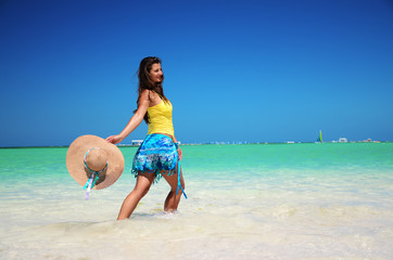 Wall Mural - Young woman relaxing on tropical carribean beach