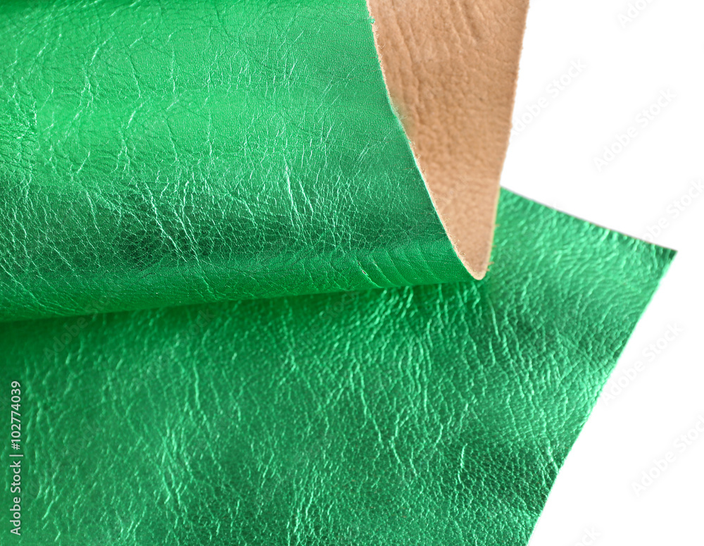 Green leather texture on white background, close up