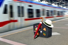 Retro Suitcase At Train Station Platform