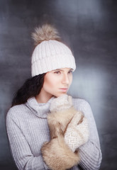 Wall Mural - Brunette woman in warm winter pullover.