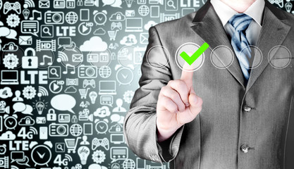 business man touching, pressing modern button with green ticking Check Box.