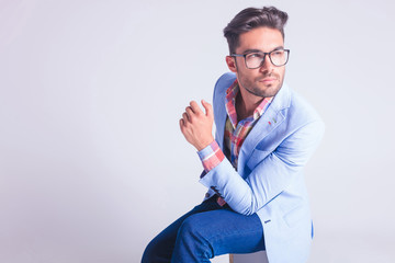 Canvas Print - portrait of smart casual man wearing glasses, seated