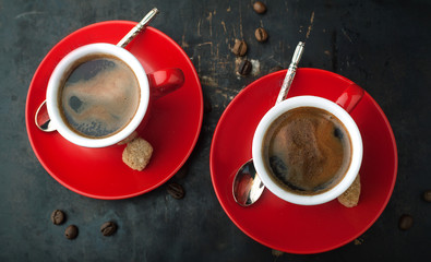 Red cup of coffee and coffee beans