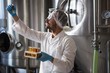 © Wavebreak Media - Focused brewer working in the plant