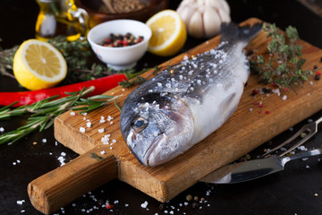 Canvas Print - Fresh fish dorado with fragrant spices, herbs and spices