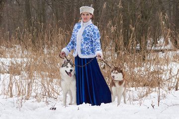 Wall Mural - Young russian woman with two dogs