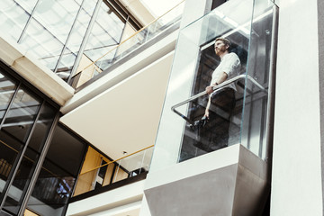 Businessman taking the elevator