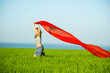 © mr.markin - Young happy woman in wheat field with fabric. Summer lifestyle