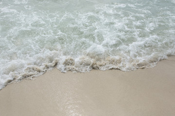 Wall Mural - Closeup rippled wave at the tropical beach