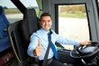 © Syda Productions - happy driver driving bus and snowing thumbs up