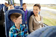 © Syda Productions - happy family riding in travel bus
