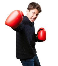Little Boy Wearing Red Boxing Gloves