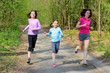 © Iuliia Sokolovska - Family sport, happy active mother and kids jogging outdoors, running in forest