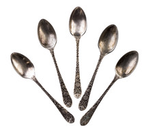Five Dirty Antique Teaspoons Over White Background