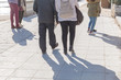 © HBpictures - Active people walking on sidewalk on sunny day in spring