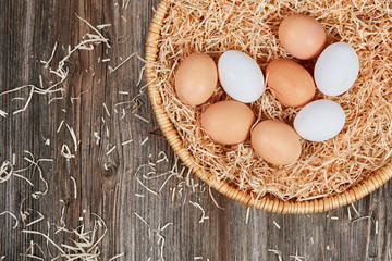 Top view of an easter nest with raw eggs