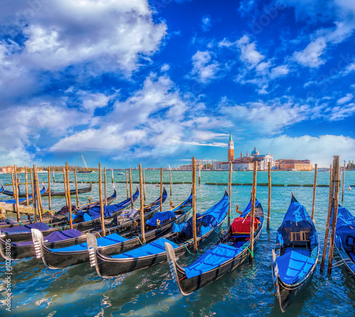 Obraz w ramie Gondolas in Venice against San Giorgio Maggiore church in Italy