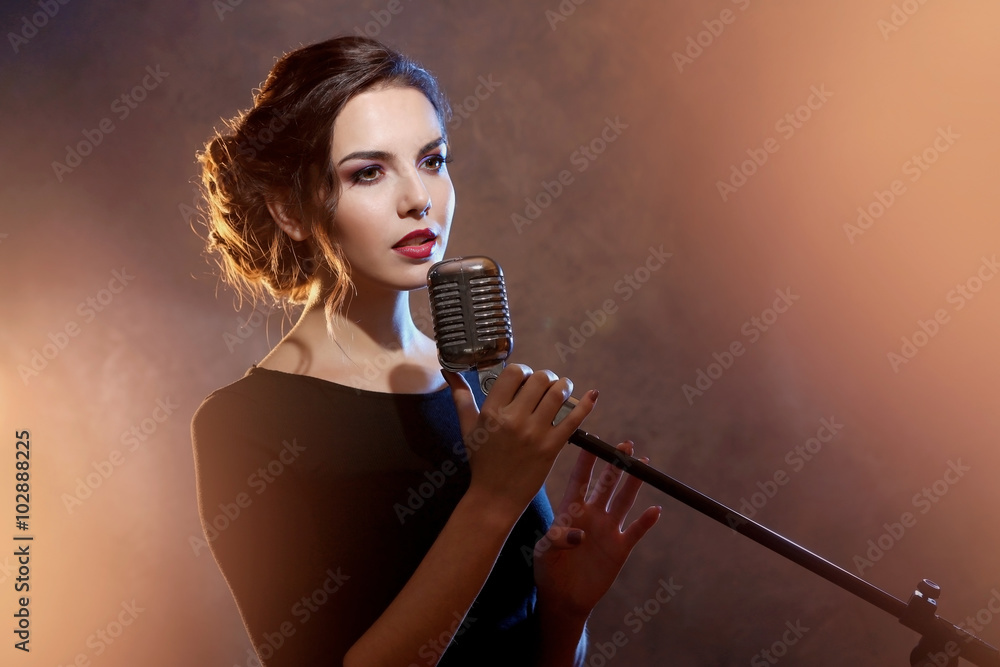 Young pretty woman singing, close up
