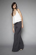 © EVGENY FREEONE - Woman posing shirt and wide-leg pants