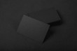 Stack Of blank black business cards on textile background 