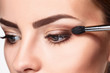 © master1305 - Beautiful female eyes with bright blue make-up and brush