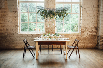 Wedding room decorated loft style with a table and accessories