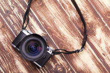 Digital Camera With Retro Style On Aged Wooden Background
