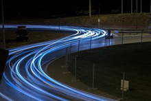 View Of Car Streak Lights At Night Near The Airport Of Faro City, Portugal.