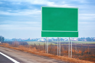 Blank traffic road sign by the roadway