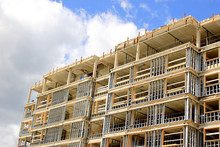 Construction Site Of Residential Building On Blue Sky Background