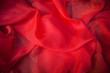 red background abstract cloth or liquid wave photo of wavy folds
