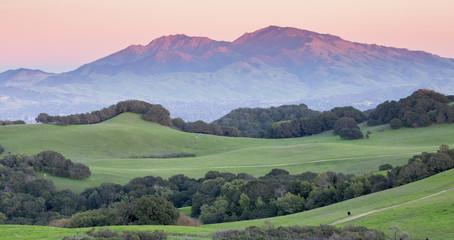 sunset over mount diablo from rolling grassy hills of briones regional park. taken from mott peak in