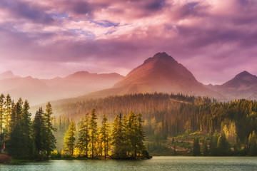 Wall Mural - sunset over a lake in high mountains
