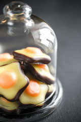 Poster - Fondant candies under the glass dome