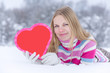 © fotoduets - Young nice woman with red heart . Valentines day.