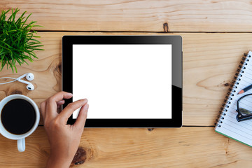 Poster - hand using mockup tablet on wood desk white display with clippin