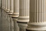 Many old greek columns with reflection