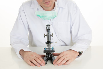 Scientist looking through a microscope in a laboratory