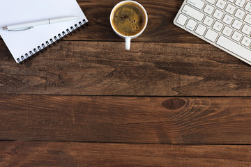 Top View of Wood Desk with Electronics Stationery and Coffee