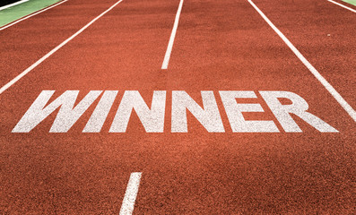 Wall Mural - winner written on running track