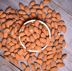 Almonds on wooden background