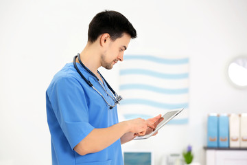 Poster - Doctor with tablet in office