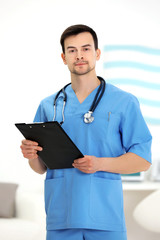 Poster - Doctor with clipboard in office