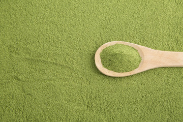 Moringa powder with wooden spoon