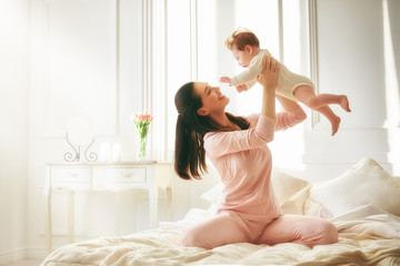 Poster - mother playing with her baby