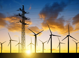Wall Mural - high voltage tower and wind turbines against the sunset
