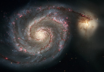 whirlpool galaxy. graceful arms of the majestic spiral galaxy.
