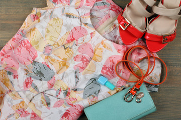 Wall Mural - multi colored dress with purse and shoes on a wooden table